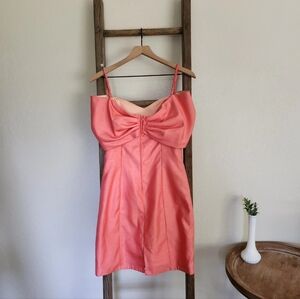 Pink off-the-shoulder party dress with bow